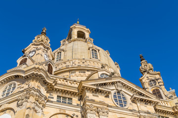 Fototapeta na wymiar Famous Frauenkirche in the city center of Dresden, Germany in the morning sun with blue sky above.