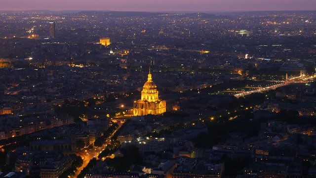 Sky view over Paris at night with the famous Hotel des Invalides.