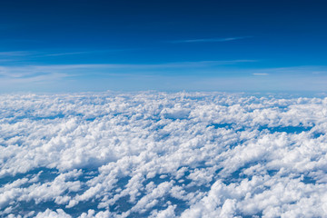 Fototapeta na wymiar Cloud texture above the sky from airplane window