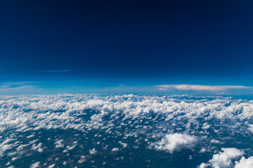 Naklejka na ściany i meble Cloud texture above the sky from airplane window