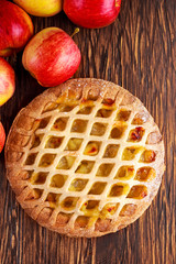 Home baked Lattice apple pie on wooden table