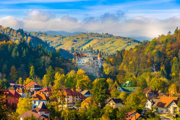 Panoramic view over Dracula medieval Castle Bran in autumn season, the most visited tourist attraction of  Brasov, Transylvania, Romania - obrazy, fototapety, plakaty