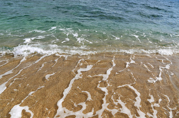 Clear sea water in the coastal sand