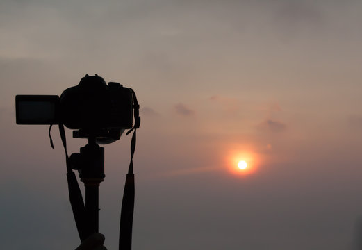 DSLR Camera with sunrise view