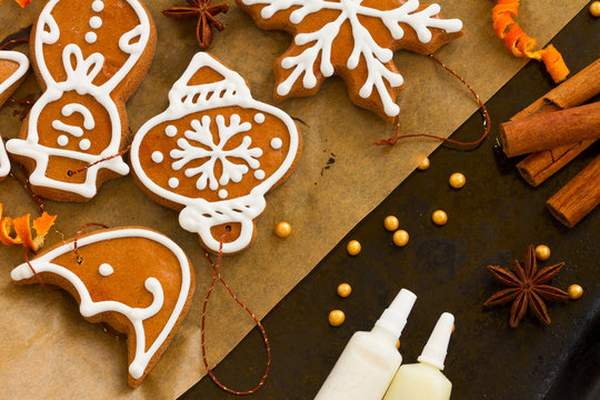 christmas gingerbread cookies with dried orange and spices on cooking paper