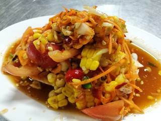 Spicy sweet corn and salted egg Thai salad - Somtum