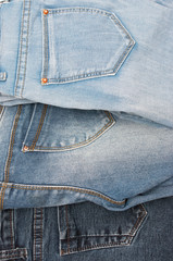 Fototapeta premium jeans of different colors as a background