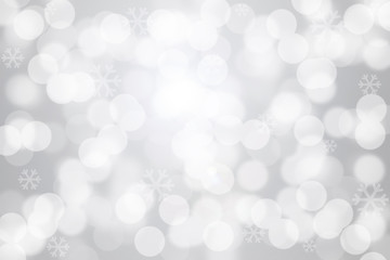 Snowflakes and bokeh light on gray background
