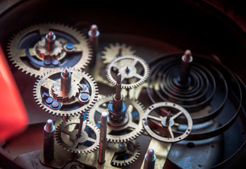 Close view of old clock mechanism with gears and cogs. Conceptual photo for your successful business design. Copy space included.