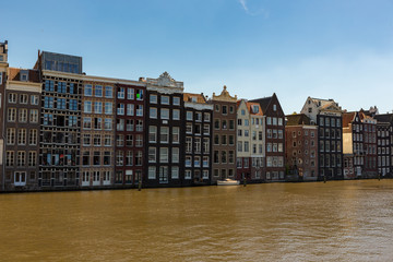 Canalhouses on the Damrak in Amsterdam Holland