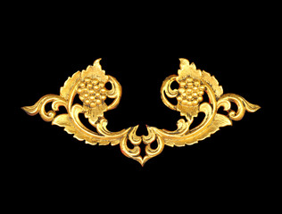Pattern of wood carve gold paint for decoration on black backgro