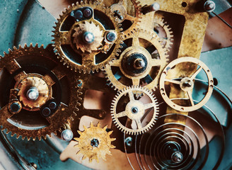 Close view of old clock mechanism with gears and cogs. Conceptual photo for your successful business design. Copy space included.