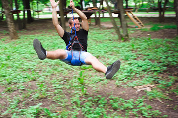 Hiking in the rope park beautiful sports guy