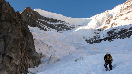 a mountain climber on a steep north face in the Swiss Alps