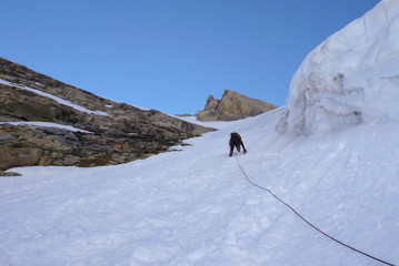 a mountain climber on a steep north face in the Swiss Alps