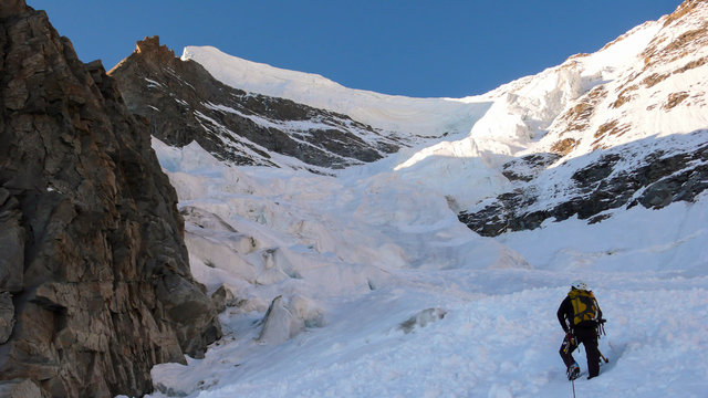 a mountain climber on a steep north face in the Swiss Alps