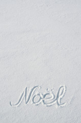Noel letters handdrawn on flat snow surface. Nice vertical Christmas holiday postcard, greeting card template. Empty space for copy, text, lettering.