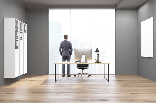 Rear view of a businessman in a CEO office
