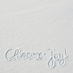 Beautiful Choose Joy letters calligraphy handdrawn on flat snow surface. Nice Christmas holiday square postcard, greeting card template. Empty space for copy, text, lettering.
