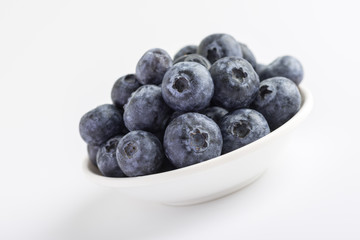 Group of fresh juicy blueberries on white background