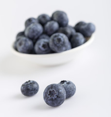 Group of fresh juicy blueberries on white background