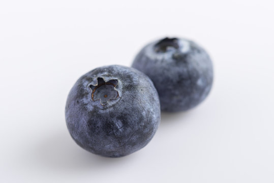 fresh juicy blueberries on white background