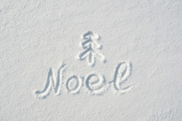 Noel letters, twig tree mark handdrawn on flat snow surface. Nice christmas holiday square postcard, greeting card.