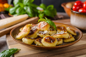 Crispy gnocchi with cheese and herbs