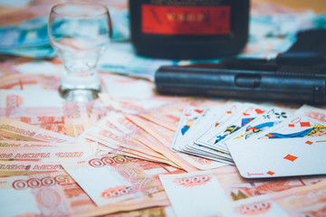 The gun and playing cards Russian big money
