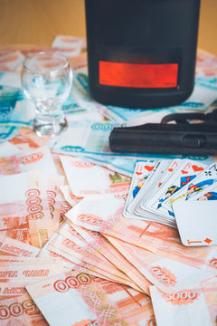The gun and playing cards Russian big money