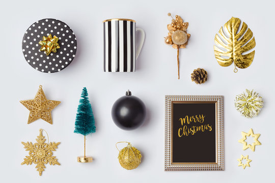 Christmas decorations and objects in black and gold for mock up template design.View from above. Flat lay