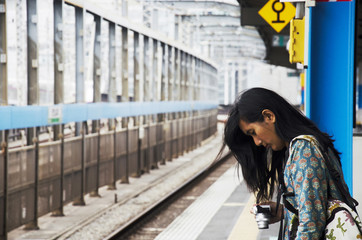 Traveler thai women standing and posing at front of track of Sai