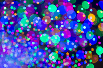 Holiday Christmas tree lights background in bright and colorful bokeh defocus abstract