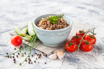 buckwheat cereal and vegetables on a table, selective focus