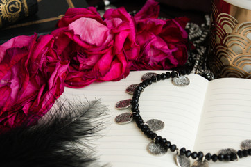 Dry roses and pink diary in gothic set-up 2
