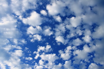 Summer blue sky with small white clouds