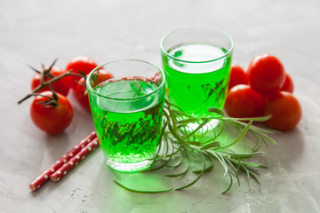 drink an estragon in a glass on a table, selective focus