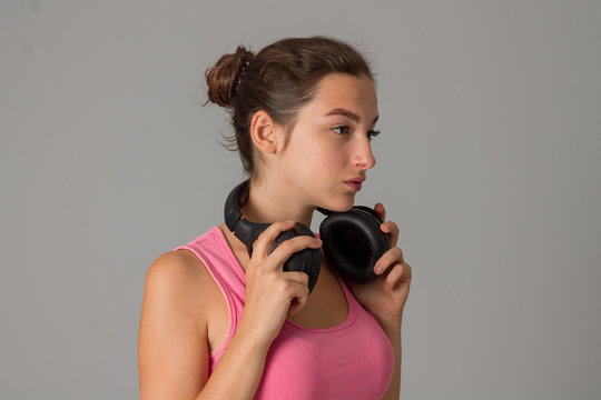 girl with headphones in studio