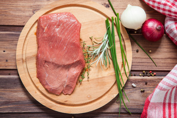 piece of beef and vegetables on a table, selective focus