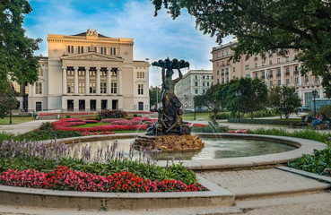 Latvian National Academic Opera and Ballet Theatre house in Riga while beautiful summer sunset light - obrazy, fototapety, plakaty