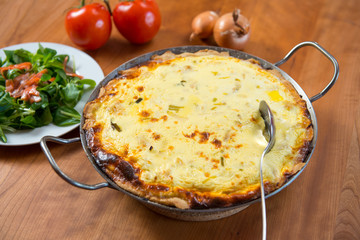 baked quiche with field salad