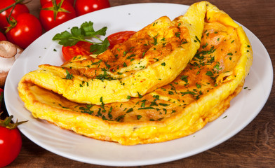 omelette in a plate on wooden table