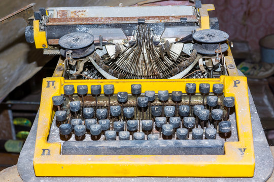 Retro broken typewriter in abandoned place