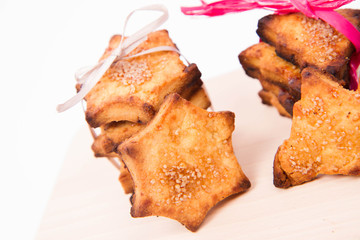 Christmas cookies on a wooden board on a white background