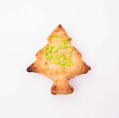 Christmas tree shaped cookie on white background