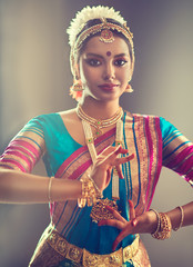 Fototapeta premium Beautiful indian girl dancer of Indian classical dance bharatanatyam . Culture and traditions of India. 