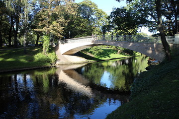 Fototapeta na wymiar Bridge in city park in Riga, Latvia