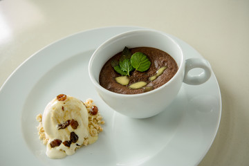 Dessert parfait with vanilla ice cream and nuts 