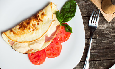 Omelette with cheese and ham for breakfast