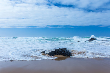 View of Guincho Beach, Cascais, Portugal. Empty beach. No people. Beauty in nature. Waves on the Atlantic ocean. Beautiful landscape.